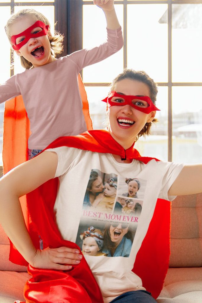 White T-Shirt With “Best Mom Ever” Text And A 4-Photo Collage Of Mom And Daughter, Styled With A Red Cape And Superhero Theme—Mother’s Day Gift Idea.
