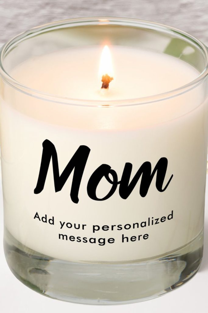 White Glass Candle With The Word “Mom” In Bold Script And Space For A Custom Message Below—Simple, Elegant Mother’s Day Gift.