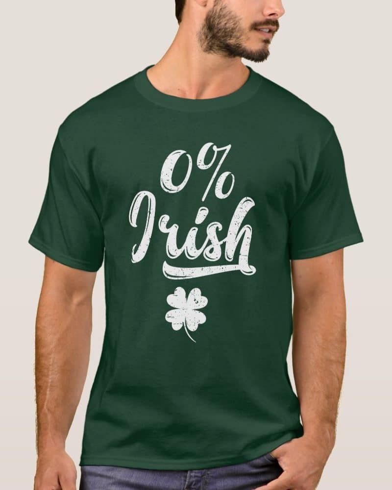 Dark green t-shirt with a distressed white design that says 0% Irish and a shamrock.