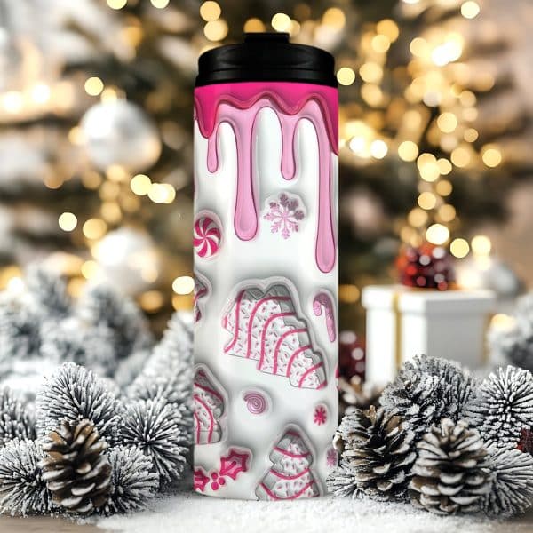 Pink And White Christmas-Themed Travel Mug With Candy Cane And Snowflake Designs.