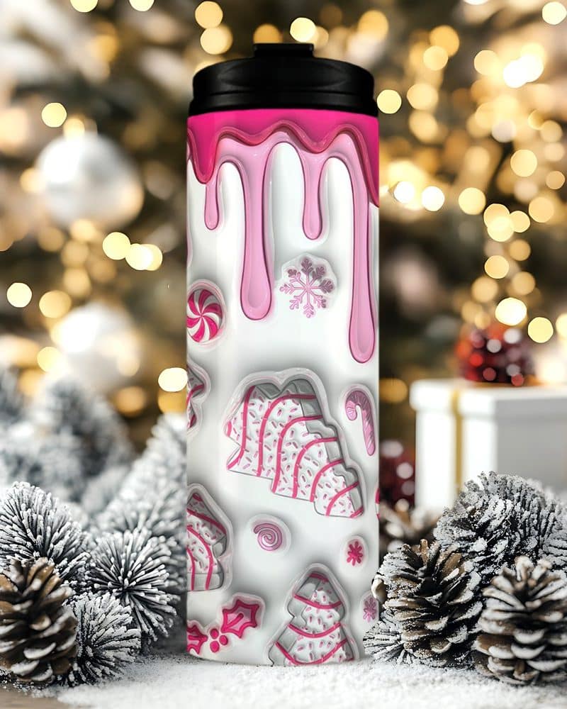 Pink and white Christmas-themed travel mug with candy cane and snowflake designs.