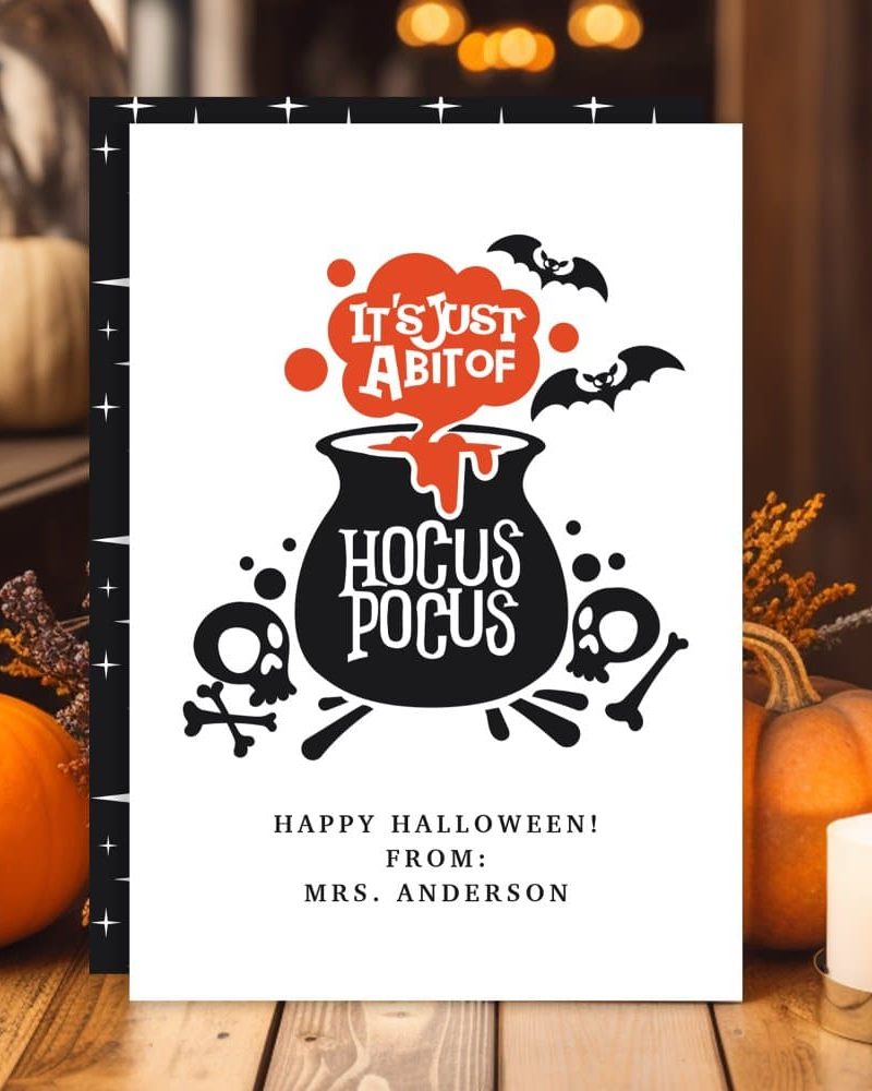 Halloween card featuring a cauldron with "Hocus Pocus" and bats.