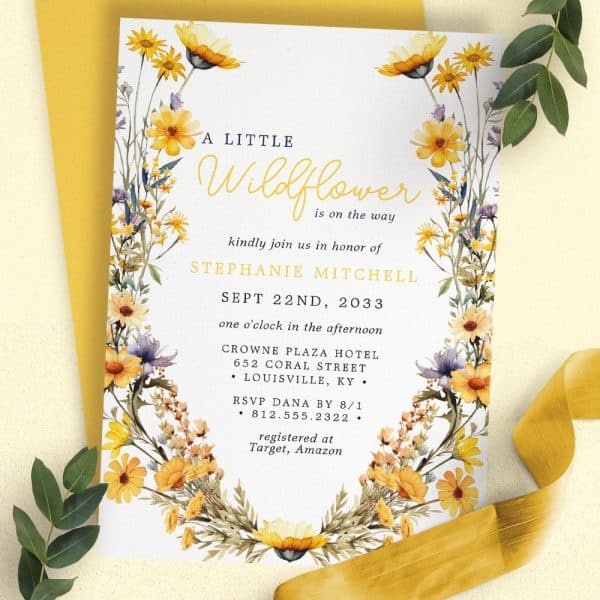 A Baby Shower Invitation For Stephanie Mitchell Featuring A Floral Wreath Border.