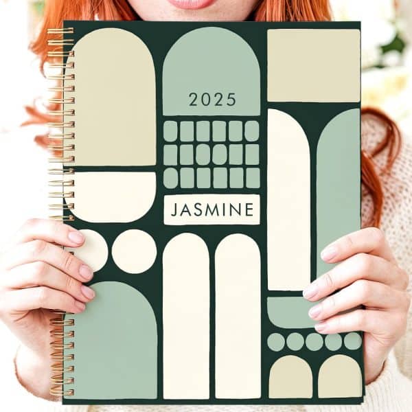 Person Holding A 2025 Planner With A Green And Beige Abstract Design And The Name Jasmine.