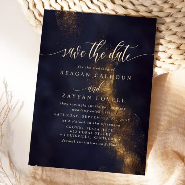 Navy Blue Save-The-Date Announcement With Gold Lettering For The Wedding Of Reagan Calhoun And Zayyan Lovell.