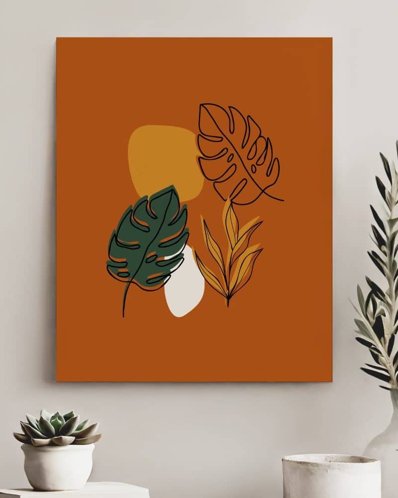 Abstract art print featuring line drawings of tropical leaves in greens and golds on a burnt orange background.