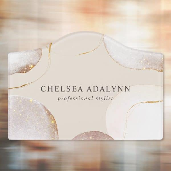 A Beige Business Card With Gold Accents And The Name Chelsea Adalynn, Professional Stylist.