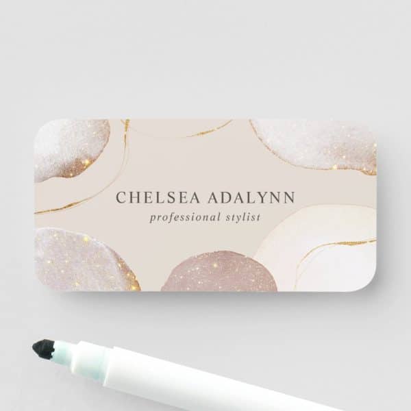 Chelsea Adalynn Professional Stylist Business Card With An Abstract Design Featuring Beige And Gold Accents.