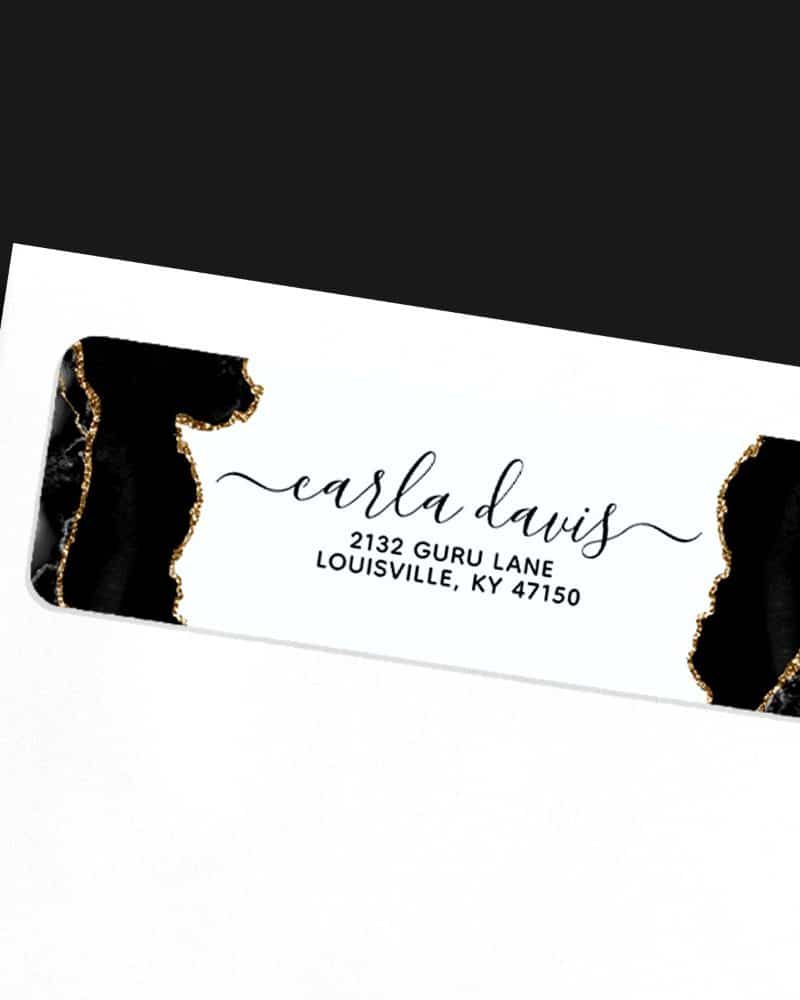 Black and gold return address label with Carla Davis's name and address.