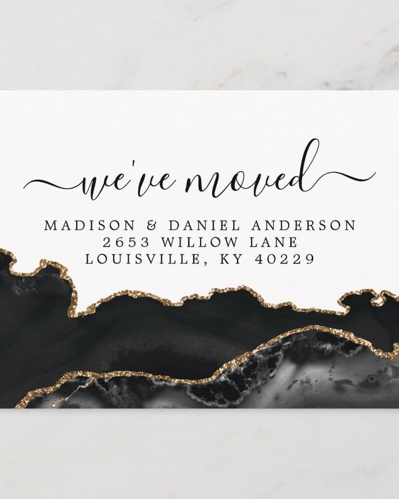 A change of address announcement with a black and gold agate design. The announcement states Madison & Daniel Anderson's new address.