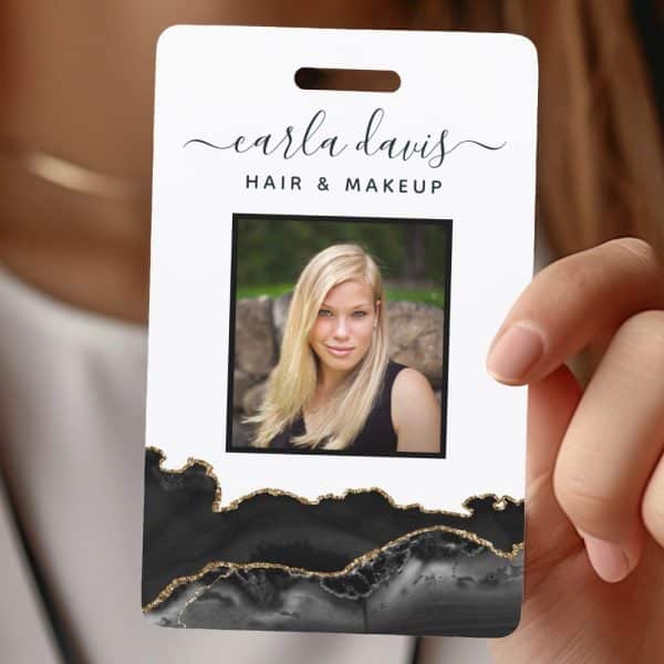 Black And Gold Agate-Style Name Tag With A Photo Of Carla Davis, Hair And Makeup Artist.