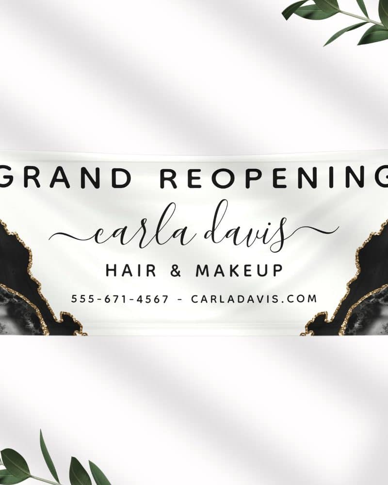 Grand reopening banner for Carla Davis Hair & Makeup, featuring a black and gold marble design.