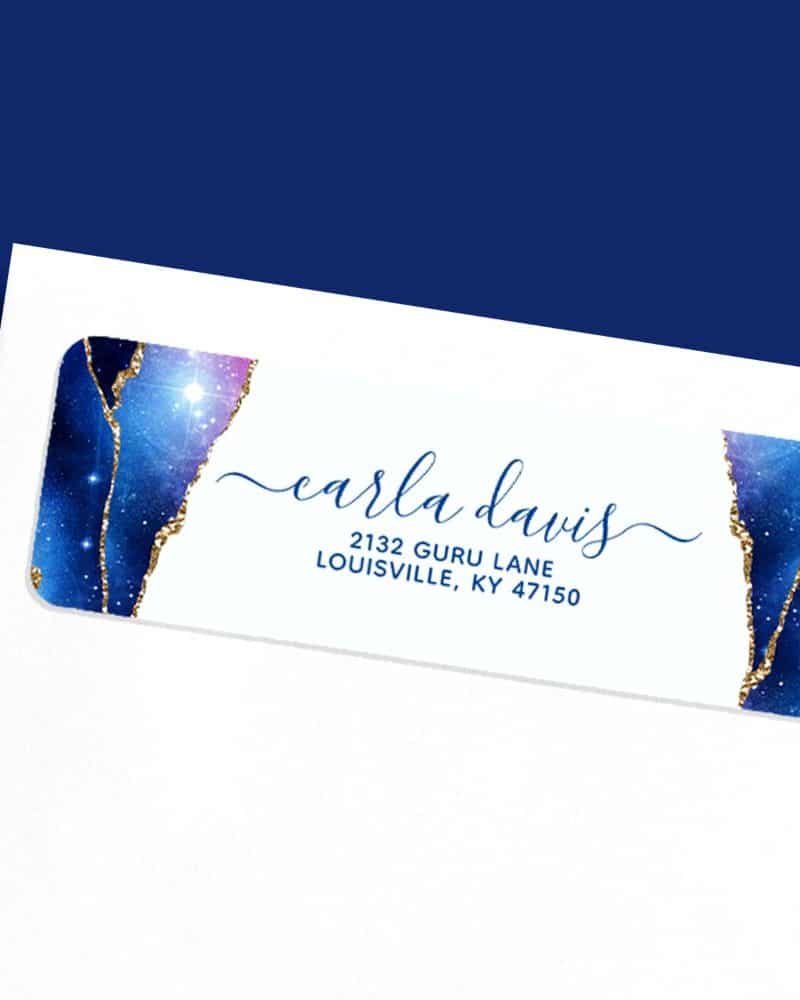 Return address label with a galaxy design in blues and golds, featuring Carla Davis's name and address.