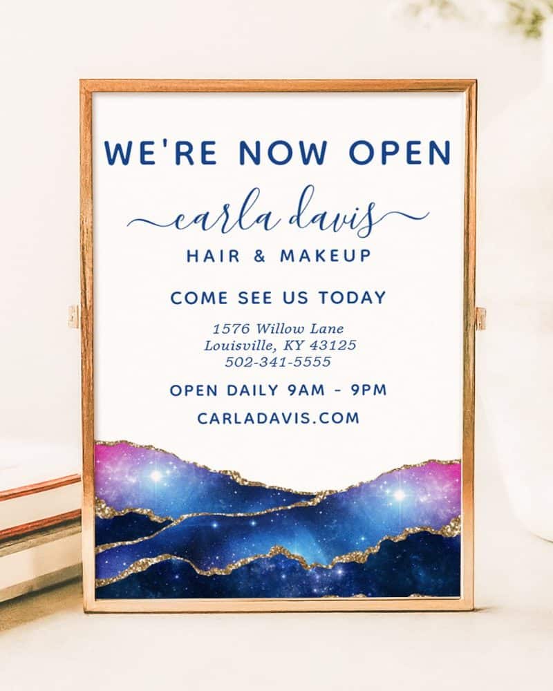 A framed announcement: Carla Davis Hair & Makeup is now open. The announcement includes the business address, phone number, and website.