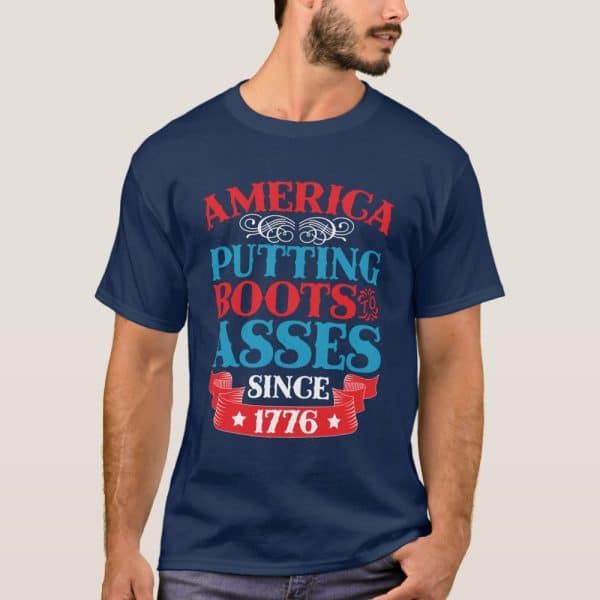 Navy Blue T-Shirt With The Text America Putting Boots To Asses Since 1776 In Red, White, And Blue.