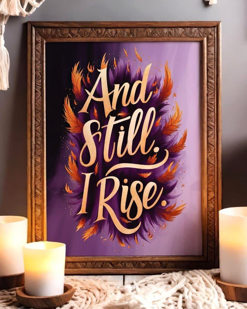 Framed art print with gold lettering on a purple background that reads And Still I Rise.