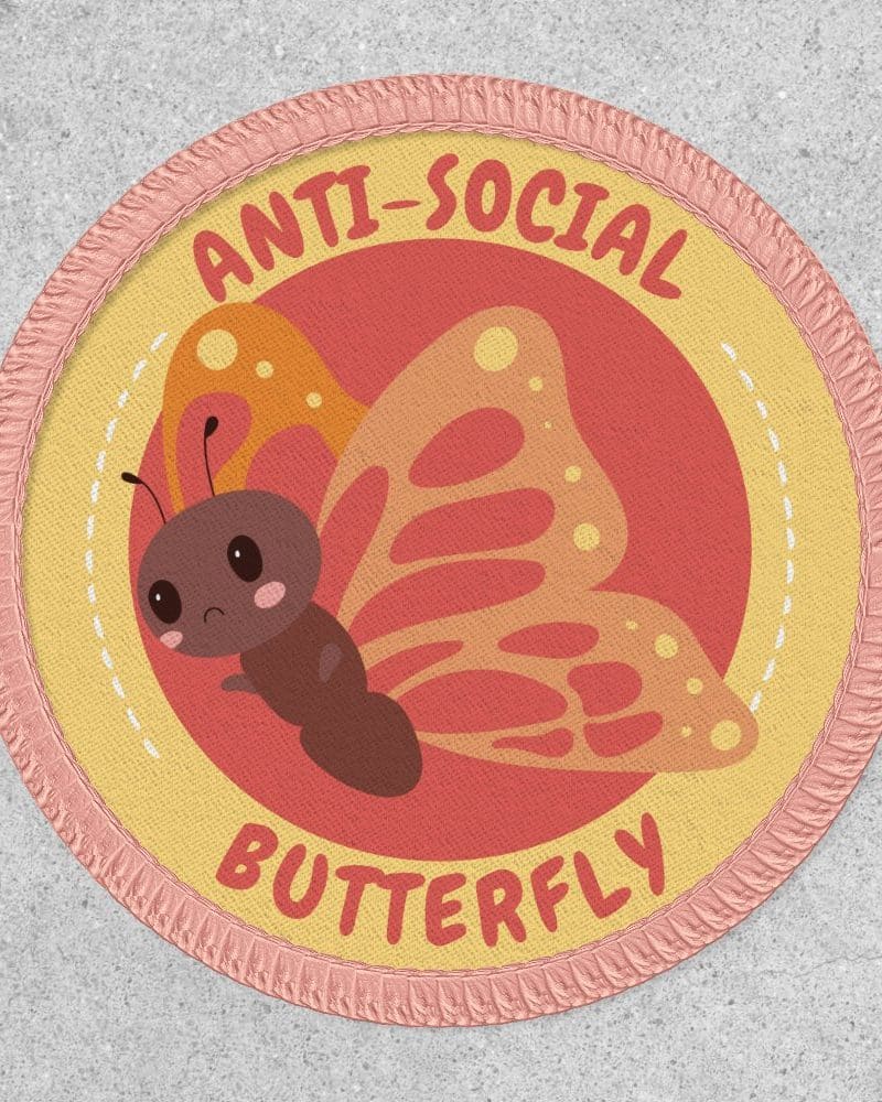Circular Anti-Social Butterfly patch with a cartoon butterfly illustration.