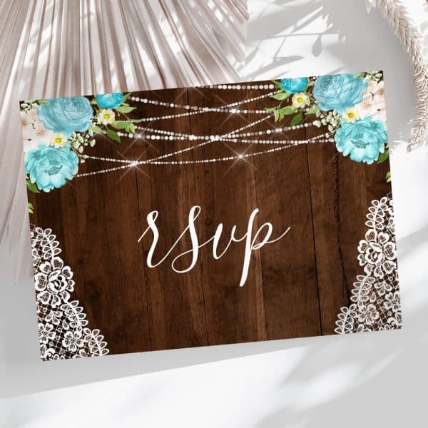 Rsvp Card With Rustic Wood Background, Light Blue Flowers, And White Lace Corners.
