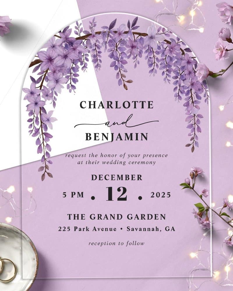 Clear acrylic wedding invitation with purple floral arch design, announcing Charlotte and Benjamin's December 12, 2025 wedding at The Grand Garden.