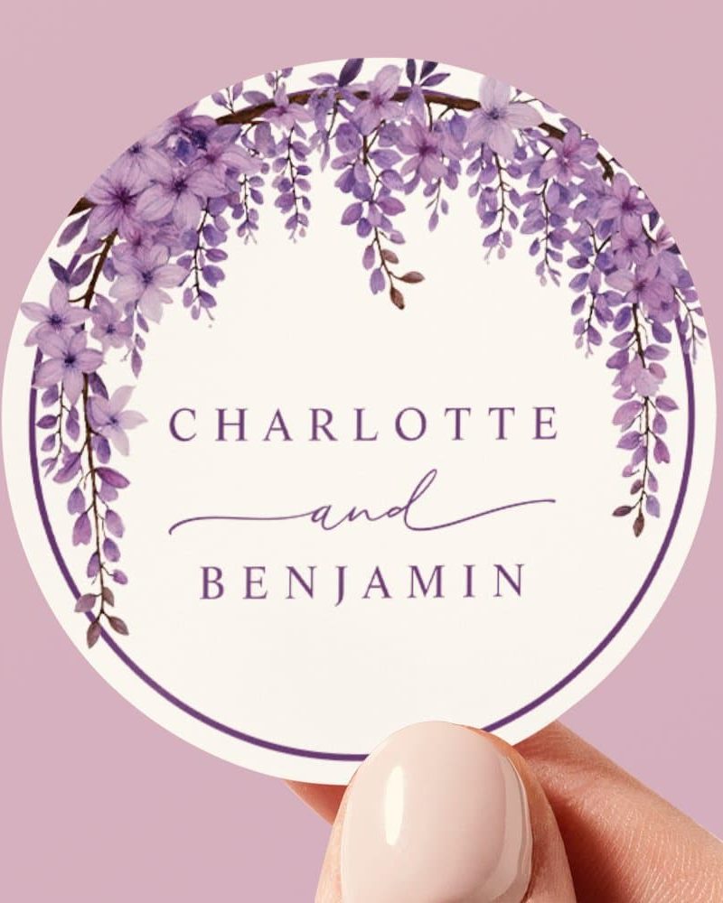 Round sticker with purple wisteria flowers forming a wreath around the names Charlotte and Benjamin.