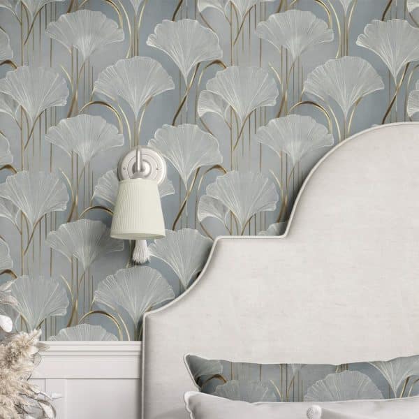 A Curved Headboard Against A Wall Covered In Light Blue Wallpaper Featuring A Repeating Pattern Of Gold And White Ginkgo Leaves.