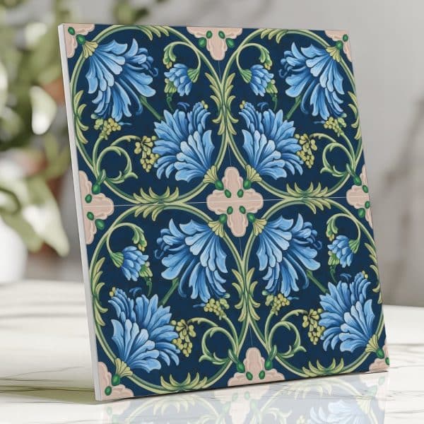 Square Tile Featuring A Repeating Pattern Of Stylized Blue Flowers And Green Leaves On A Dark Blue Background.