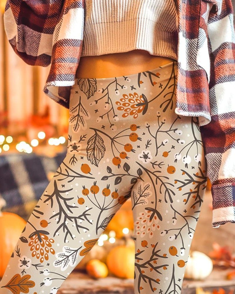 Beige leggings with an autumnal floral pattern.