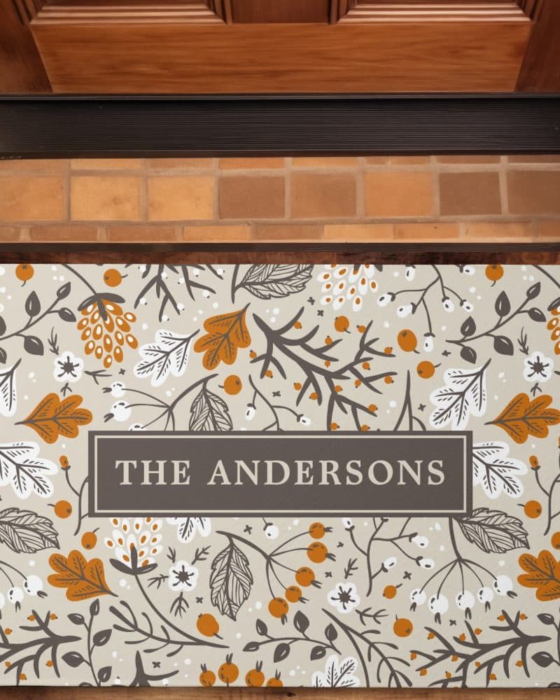 Doormat with a floral design and the name The Andersons.