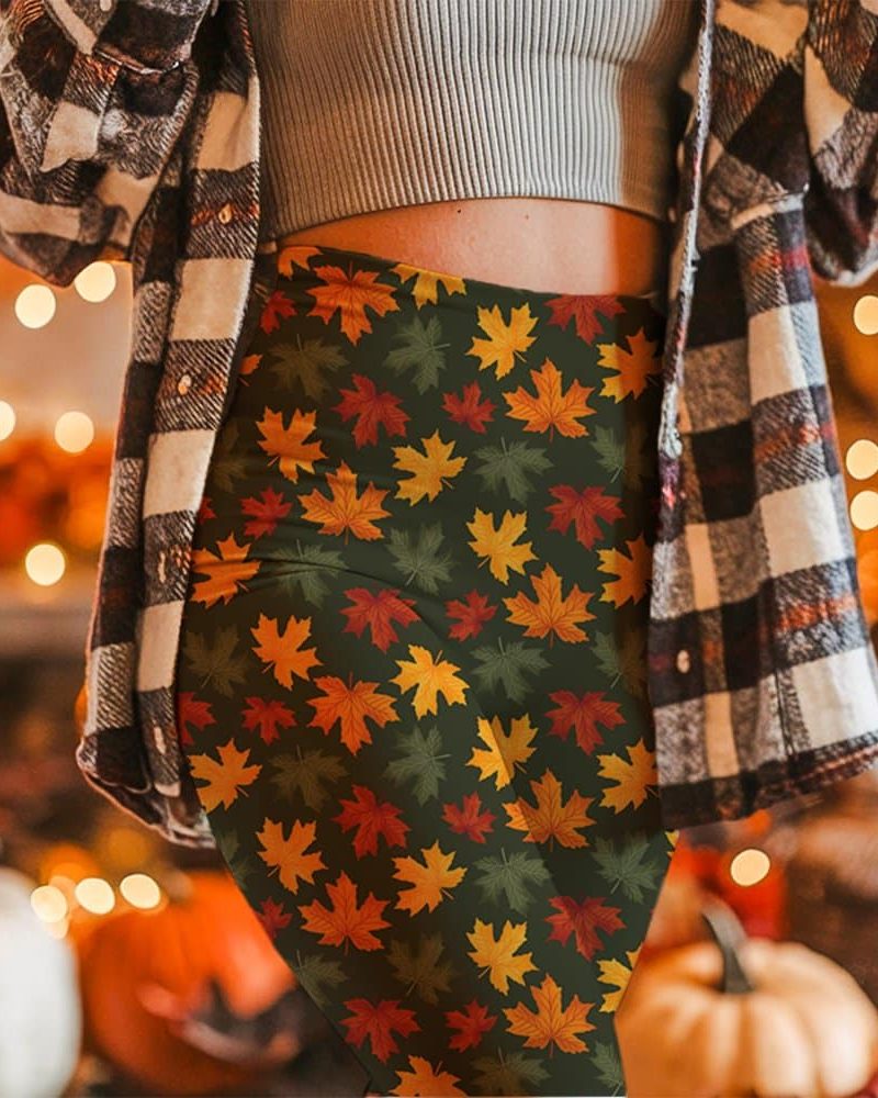 Autumn leaf leggings on a person's lower body.