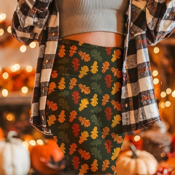 Woman Wearing Leggings With An Autumn Leaf Pattern.