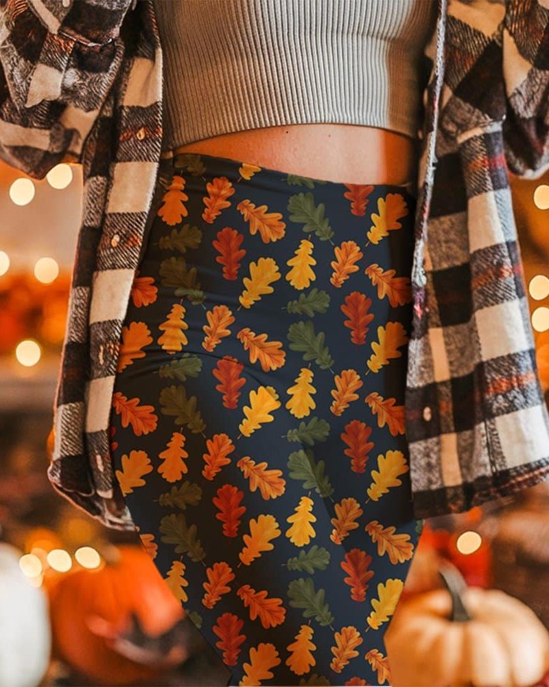 Autumn-leaf patterned leggings on a woman.