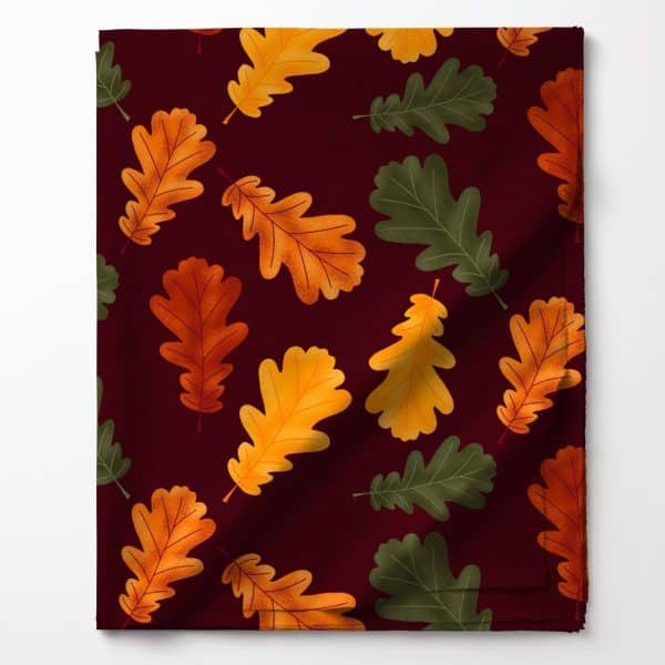 Dark Red Fabric With A Repeating Pattern Of Orange, Gold, And Green Oak Leaves.