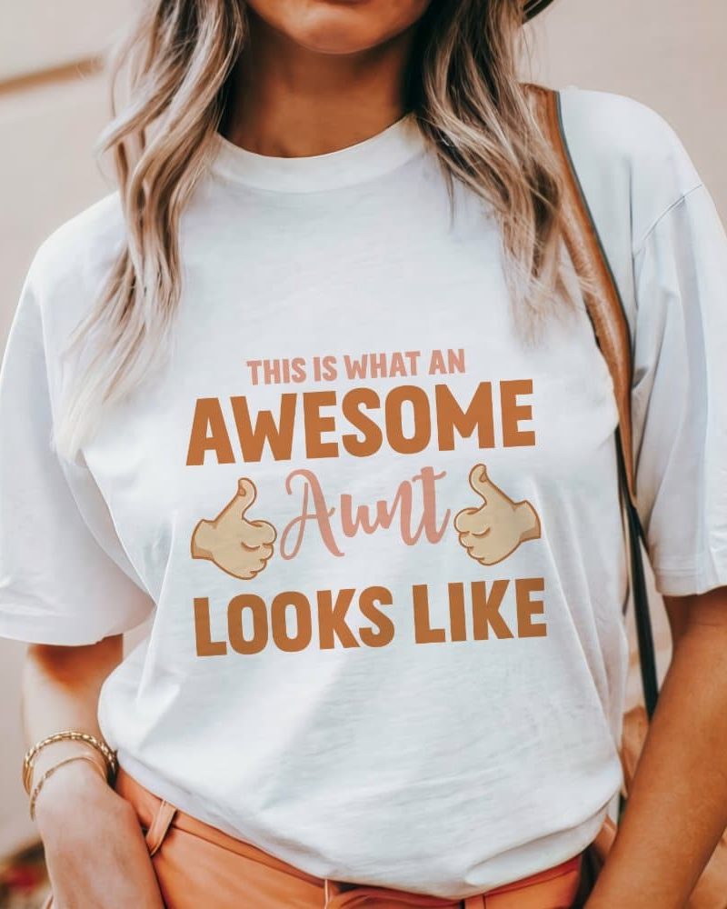 Woman wearing a white t-shirt that says This is what an Awesome Aunt looks like.