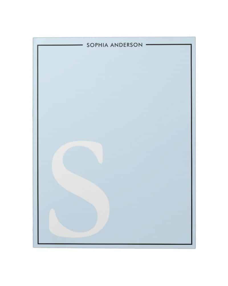 Light blue notepad with a large white letter S and the name Sophia Anderson at the top.