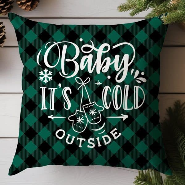 Green And Black Buffalo Plaid Throw Pillow With The Text Baby, It'S Cold Outside And A Pair Of Mittens.