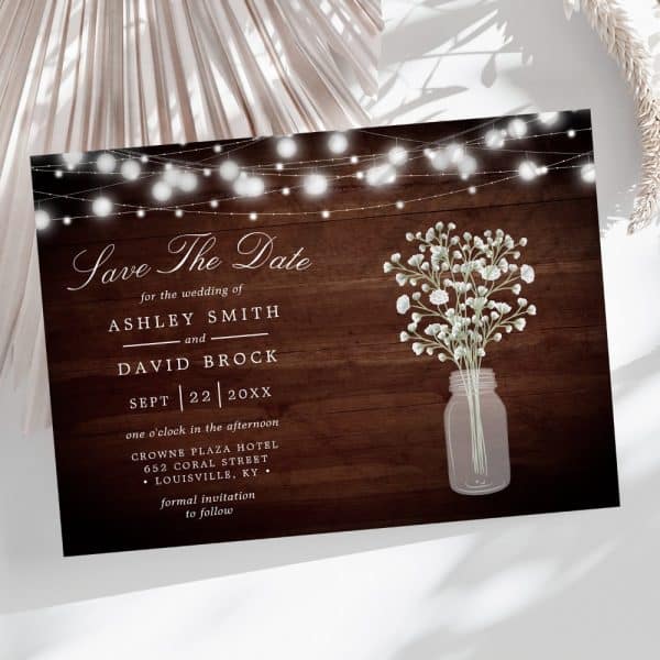 Save The Date For Ashley Smith And David Brock'S Wedding, September 22Nd. The Design Features String Lights And Baby'S Breath In A Mason Jar.