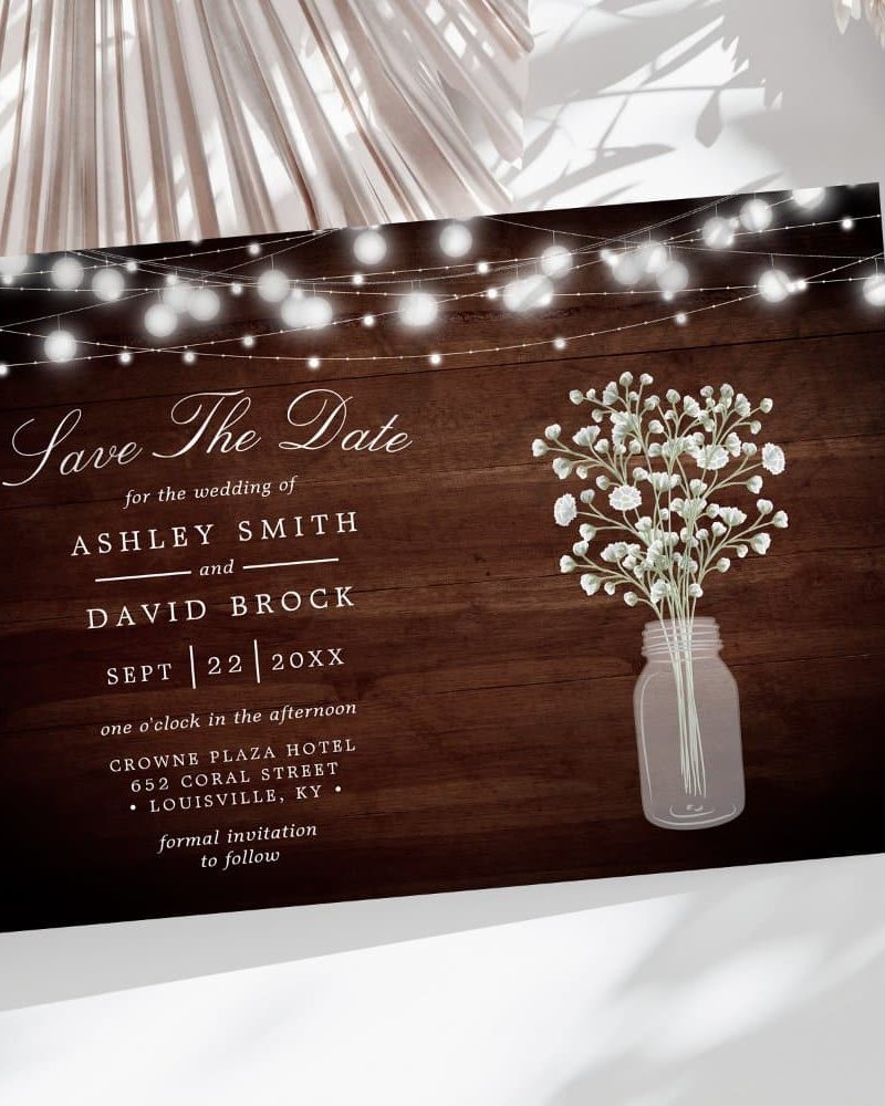 Save the date for Ashley Smith and David Brock's wedding, September 22nd. The design features string lights and baby's breath in a mason jar.