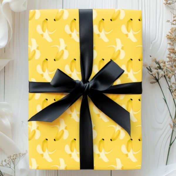 Yellow Gift Box With A Banana Peel Pattern And Black Ribbon.