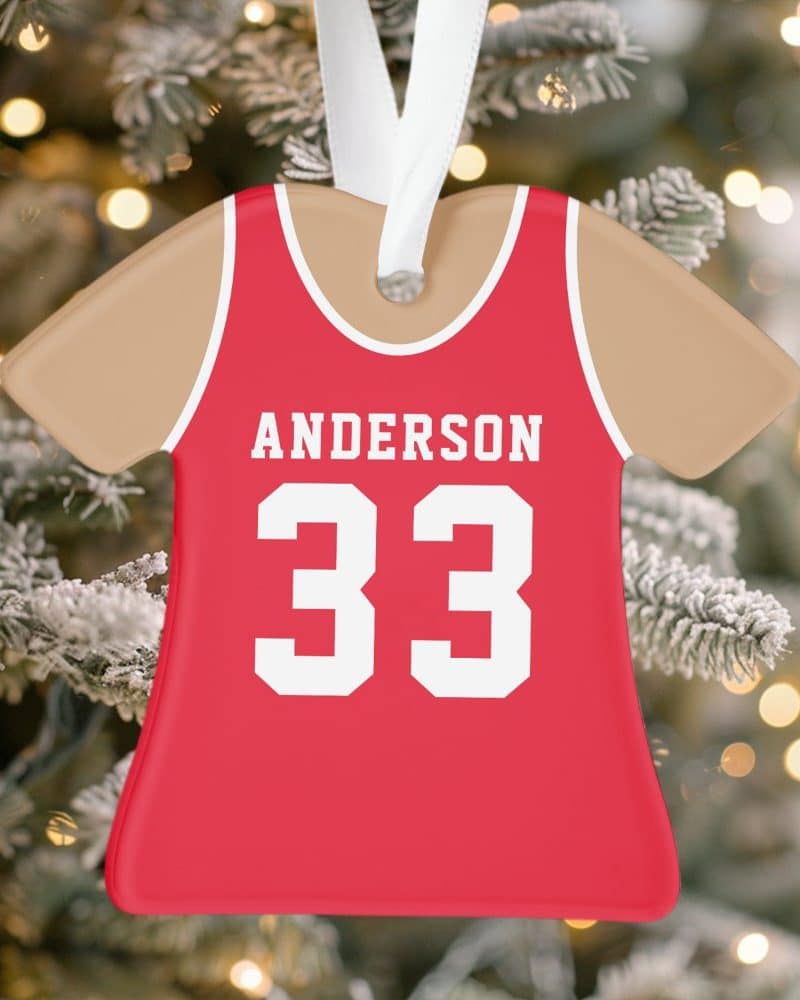 Red and tan personalized jersey-shaped Christmas ornament with the name Anderson and number 33.