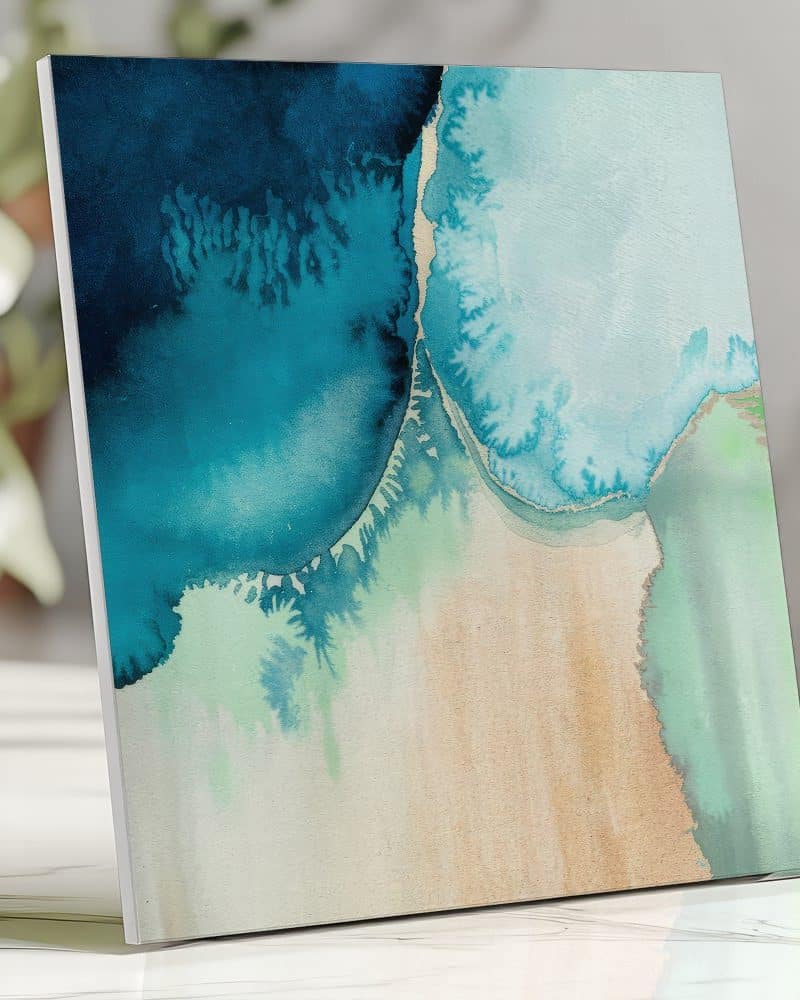 Abstract painting of teal and green watercolor washes on a beige background.