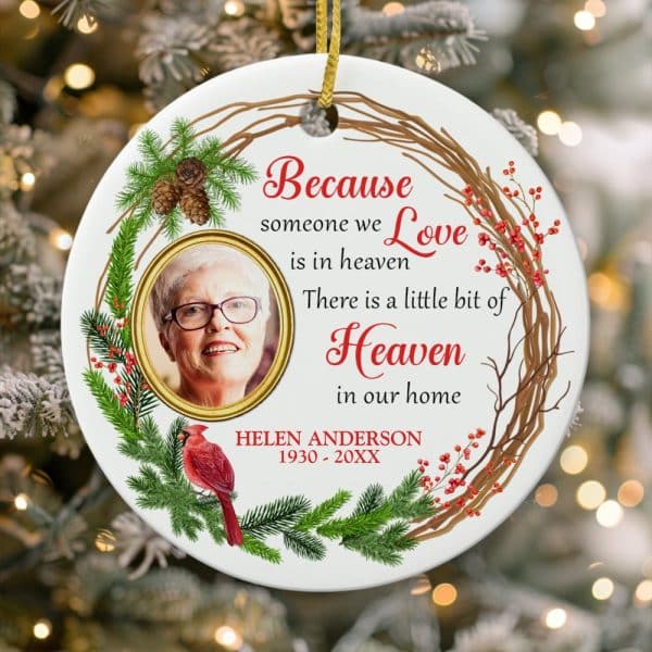 Round Christmas Ornament With A Photo Of A Woman, A Cardinal, And A Wreath Design; Text Reads: Because Someone We Love Is In Heaven, There Is A Little Bit Of Heaven In Our Home. Helen Anderson, 1930-20Xx.