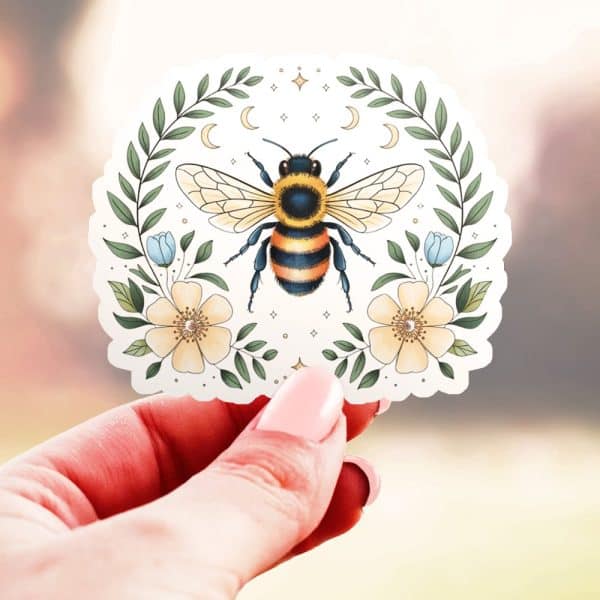 A Bumblebee Sticker Surrounded By Flowers And A Crescent Moon.
