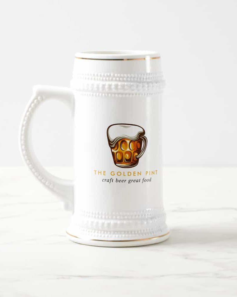 White beer stein with The Golden Pint logo.