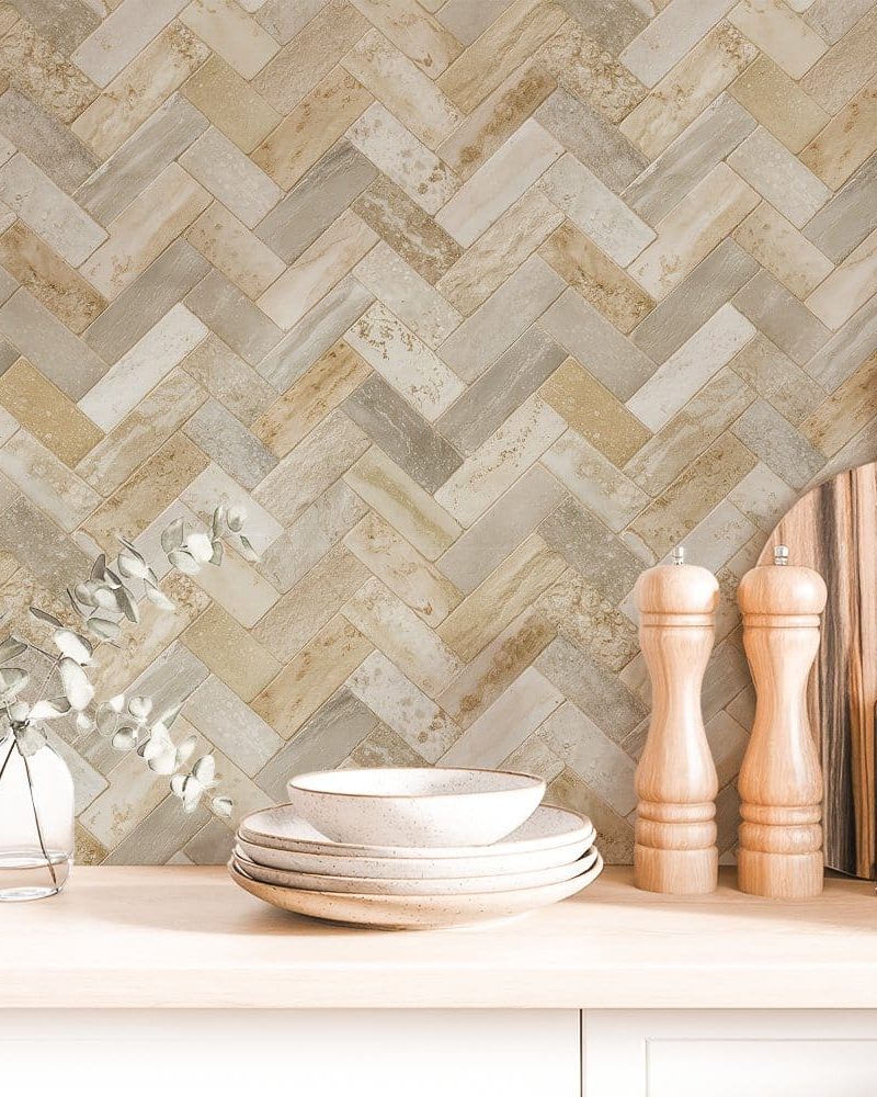Beige and gray herringbone patterned backsplash tile.