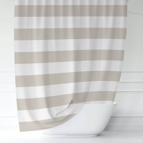 Beige And White Striped Shower Curtain Partially Draped Over A White Bathtub.