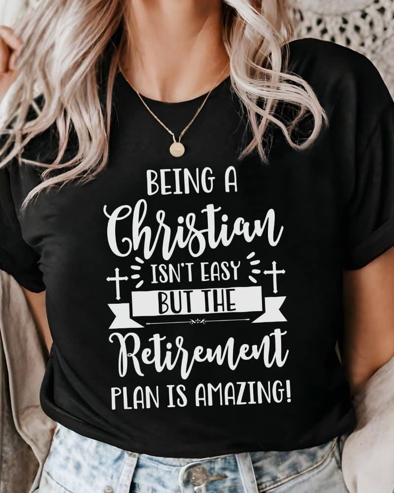 Black t-shirt with white text that says, Being a Christian isnt easy but the retirement plan is amazing.