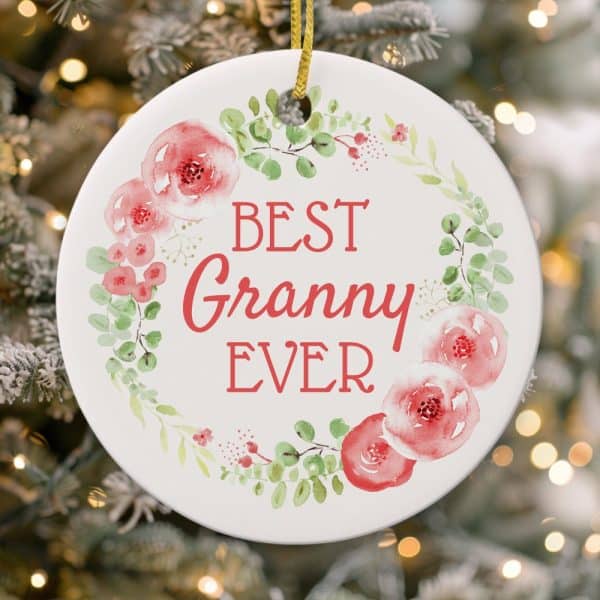 Round Christmas Ornament With A Floral Wreath And The Text Best Granny Ever.