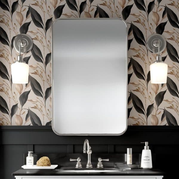 Bathroom Vanity With A Large Rectangular Mirror Flanked By Wall-Mounted Lights, All Set Against Floral Wallpaper.