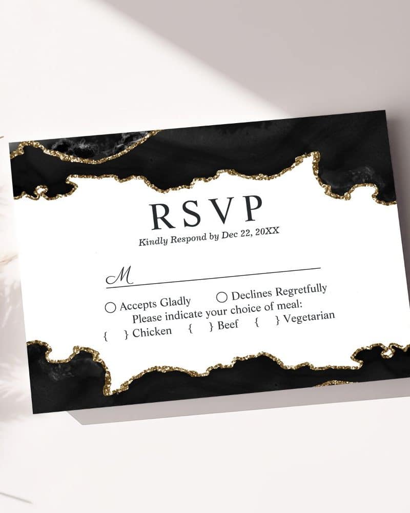 Black and gold RSVP card with options for meal selection.