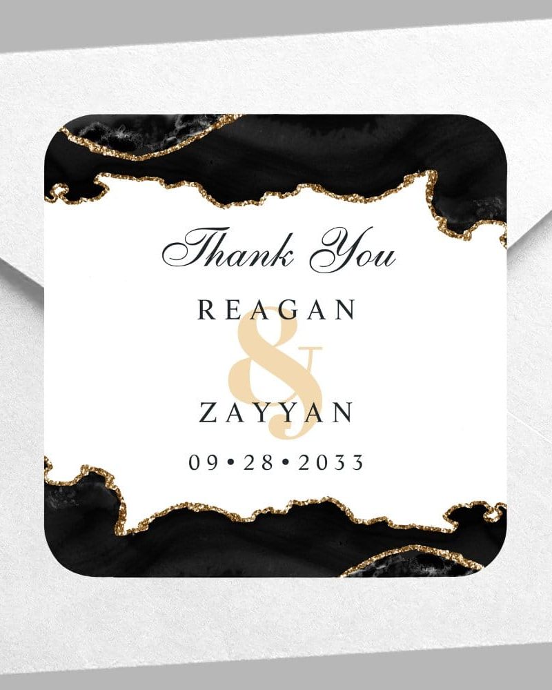 Wedding thank you card with black and gold agate design, featuring the names Reagan & Zayyan and the date 09.28.2033.
